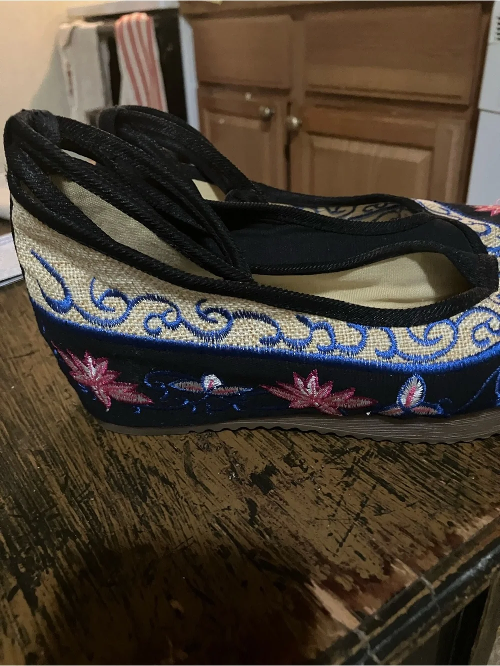 Black Embroidered Wedge Slip-On with Colorful Floral Accent!